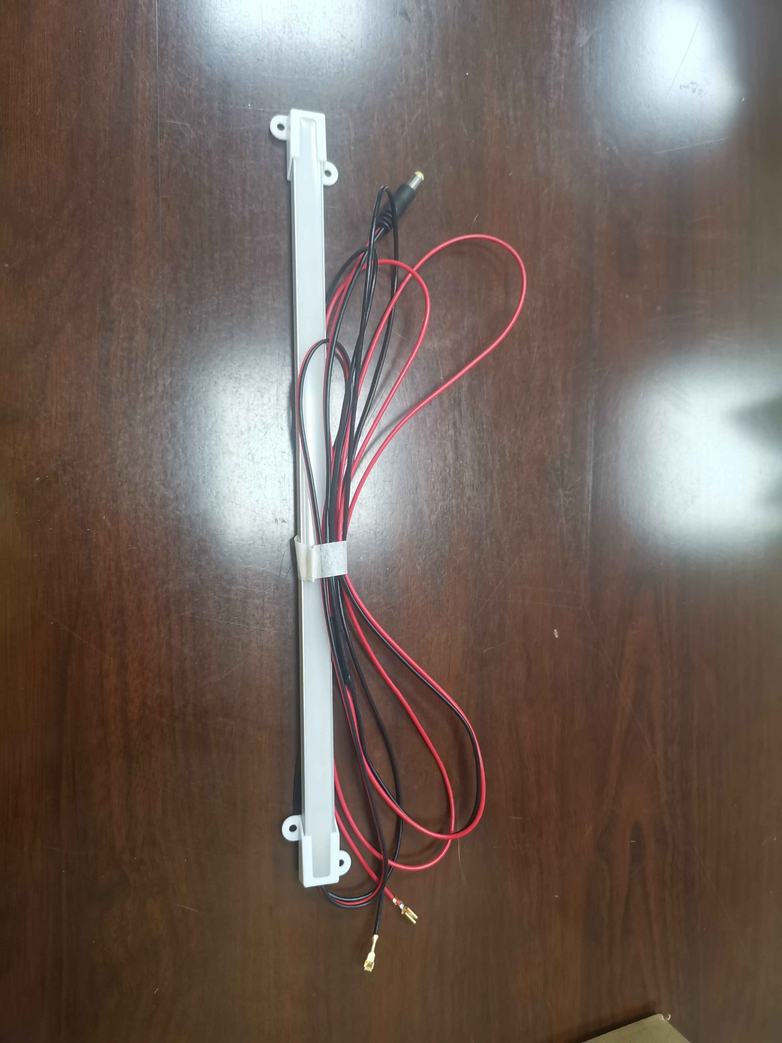 Professional colon hydrotherapy machine parts and accessories displayed on medical equipment table